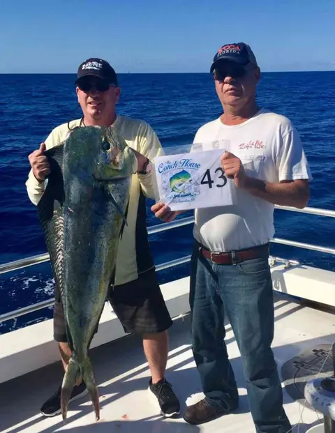 Two anglers with a mahi-mahi caught offshore from Fleming Island, FL